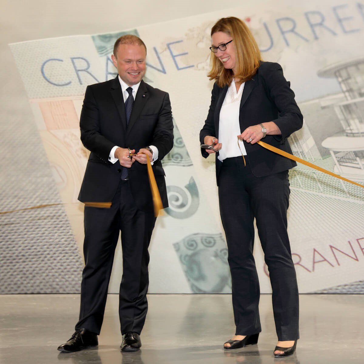 Hon. Dr. Joseph Muscat and Annemarie Watson cut the ribbon at the malta printworks opening ceremony