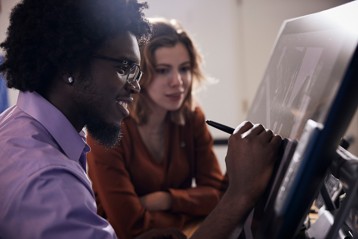 DaSean Clark and Caitlin Byham sketching the security features of the future.