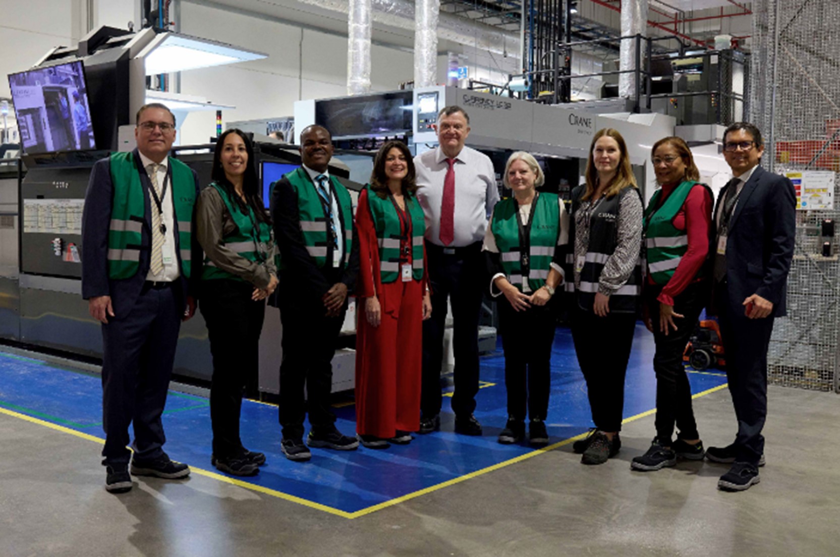 A group photo of the CBCS team with John Scott at the Malta print works